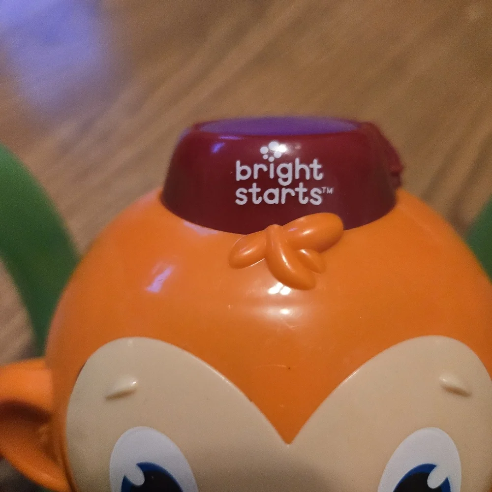 Bright Starts Roll & Glow Monkey  Colorful Rolls Sings Baby Infant Crawling Toy